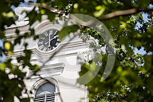 Close up on Church clocktower steeple of the serbian orthodox church of Alibunar, Voivodina, Serbia with its iconic clock