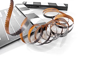 Close up cinema movie clapperboard with filmstrip