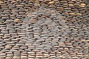 Close up of circle pebble wall