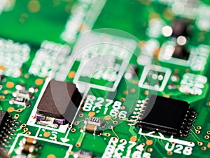 Close-up of circuit board with integrated circuits, resistors and capacitors