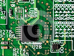 Close-up of circuit board with integrated circuits, resistors and capacitors