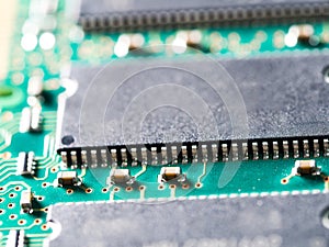 Close-up of circuit board with integrated circuits, resistors and capacitors