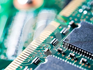 Close-up of circuit board with integrated circuits, resistors and capacitors