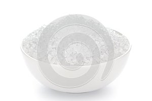 Close-up citrus crystal Citric acid anhydrous  in white ceramic  bowl on white background