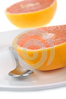 Grapefruit cut in half on a plate