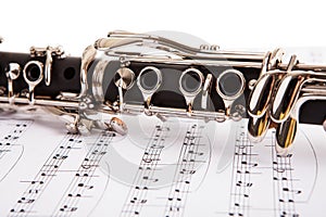 Close-up of clarinet and musical notes