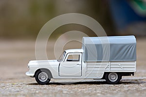 Close-up of classic miniature Peugeot 404 pick-up.