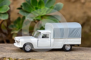 Close-up of classic miniature Peugeot 404 pick-up.