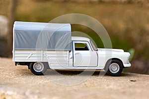 Close-up of classic miniature Peugeot 404 pick-up.