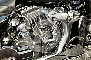 Close-up of a classic motorcycle with a chrome frame and an exhaust system