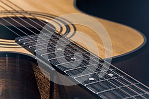 Close-up of a classical acoustic guitar in beautiful lighting