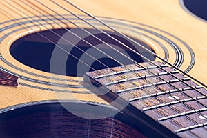 Close-up of a classical acoustic guitar in beautiful lighting