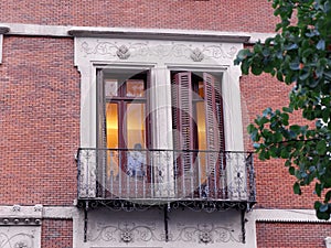 Close up on classical balcony with double doors and shutters downtown Madrid in Chueca district, Spain photo