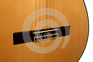 Close up of classical guitar bridge