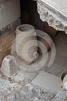 close up of clay storage vessels in the ancient site Knossos, Crete