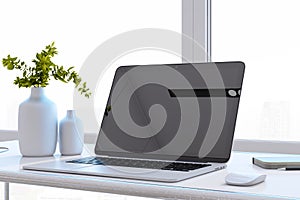 Close up of clean designer office desktop with black mock up computer monitor, reflections, decorative vase with plant, other