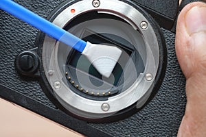close up of cleaning camera sensor,