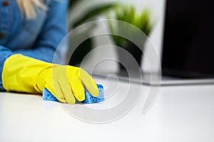 Close Up cleaning company worker hand holding sponge