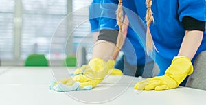 Close-up of cleaning team working in an office