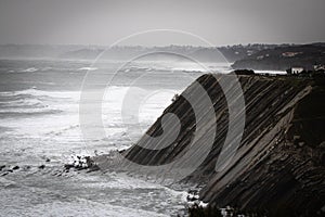 Close up of cliff and coastla shoreline in basque country, france