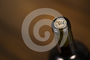 Close-up of closed wine bottles lying on blurry background