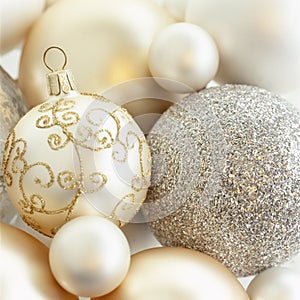 Close-up closeup of beautiful, fancy, elegant, silver, white and gold Christmas baubles ornaments. Luxury holiday decorations