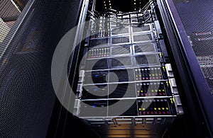 Close up cloud storage system panel modern with hard drives. Detail interior rack cluster in data center