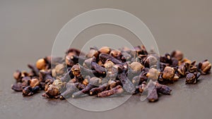 Close up cloves spice. Some dried cloves on the table.