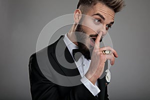 Close up of a clumsy groom picking his nose