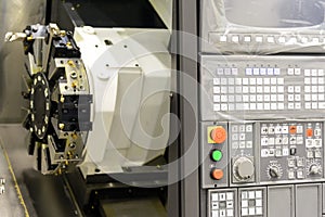 Close up of the CNC lathe panel .CNC lathe or CNC turning machine. Hi-precision CNC machining concept.