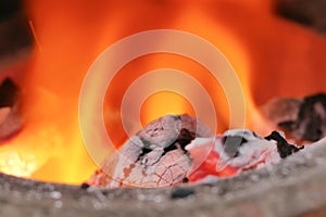 Close up coals in the fire