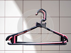 Close-up of coathanger against wall