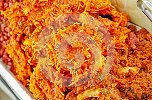 Close up of cocada, a traditional coconut dessert sold usually on the streets, made of grated coconut and brown sugar