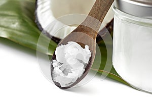 Close-up of coconut oil on the wooden spoon photo
