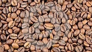 Close-up coffee beans are roasted and rotated