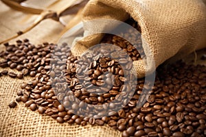 close-up of coffee beans spilling from a burlap sack