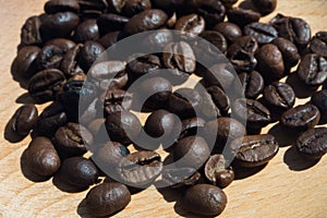 Close up coffee beans on wood plate