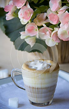 Close up of coffee cream in glasses cup on the table