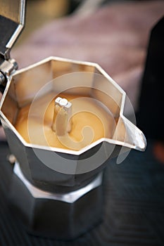 close up coffee creama in espresso boild pot
