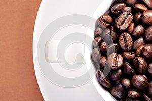 Close-up coffee cup with coffee beans