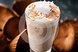 close-up of a coffee shake with a coconut flake garnish