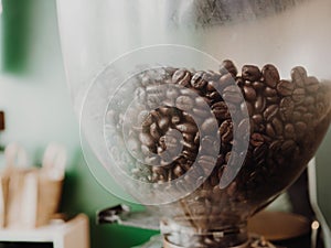 Close up of coffeen beans in the machine.