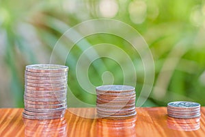 Close up of coins to stack of coins, Business Growth concept, T