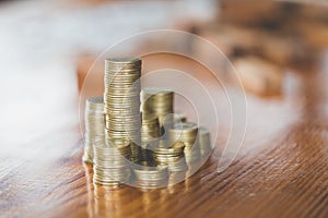 Close up of coins to stack of coins, Business Growth concept, T