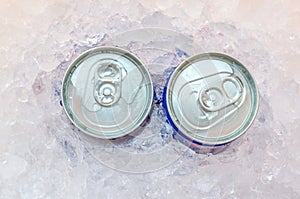 Close Up of Cola Cans in Ice