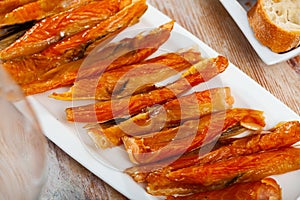 Close-up of cold smoked salmon belly at plate