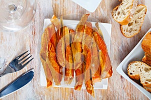 Close-up of cold smoked salmon belly at plate