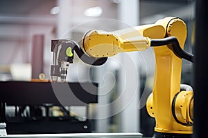 close-up of collaborative robot arm, with view of factory floor visible in the background