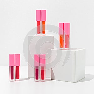 Close-up of a collection of colorful lipstick samples on a white background