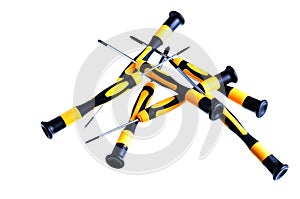 Close-up of a collection of yellow and black screwdrivers on a white background